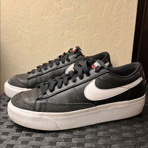 Nike Black and White Sneakers with Retro Design and Thick Rubber Sole